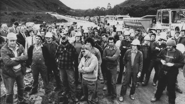 Dam workers listen to the Tasmanian Premier, Mr. Gray, near the dam site on July 4, 1983. 