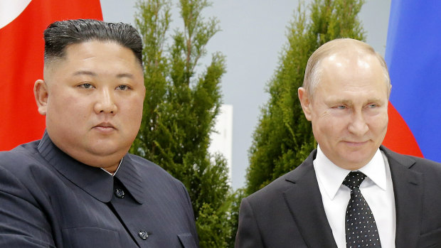 Russian President Vladimir Putin, right, and North Korea's leader Kim Jong-un shake hands during their meeting in Vladivostok, Russia. 
