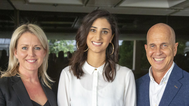 Lamisse Hamouda, daughter of Hazem Hamouda is seen posing for photograph alongside journalist Peter Greste (right) and her family's lawyer Jennifer Robinson(left) at Queensland Parliament House in Brisbane on Thursday.