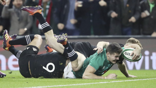 Ireland's Jacob Stockdale scores against the All Blacks in November. 