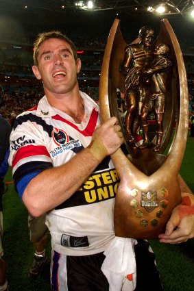 Sense of relief: Brad Fittler lifts the 2002 NRL trophy.