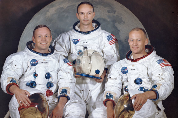 Michael Collins (centre) is pictured with fellow Apollo 11 crew members Neil Armstrong (left) and Buzz Aldrin (right) in 1969.