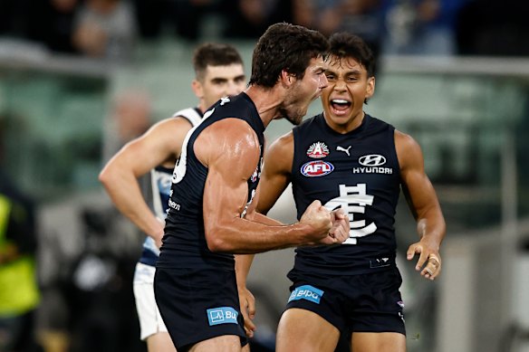 George Hewett celebrates his sealer against Geelong.