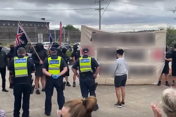 Police forming a barrier between the neo-Nazis and residents on Thursday.