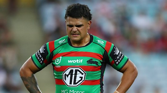 Latrell Mitchell hobbles from the field in the first half.