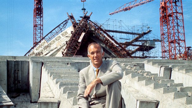 Utzon in front of the partially constructed Opera House in 1965.