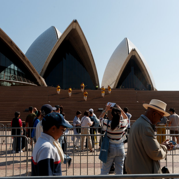 People funnel through barriers at the Opera House