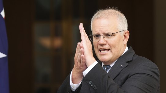 Prime Minister Scott Morrison explaining the trajectory of the Omicron outbreak on Wednesday.