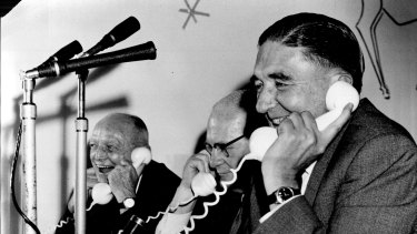 The N.S.W. Minister for Health, Mr. W.F. Sheahan (left), and the Minister for National Development, Senator W.H. Spooner (centre), listen to the Lord Mayor of Sydney, Ald. H.F. Jensen, placing the first telephone call to Melbourne on the coaxial cable system. April 9, 1962.