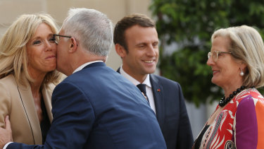 Australian Prime Minister Malcolm Turnbull kisses Brigitte Macron wife of French President Emmanuel Macron on arrival at the Elysee Palace in 2017.