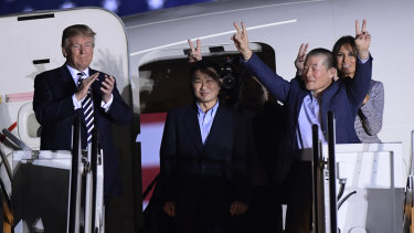 Donald Trump greets Tony Kim, Kim Hak Song, seen in the shadow, and Kim Dong Chul, at Andrews Air Force Base in Maryland.