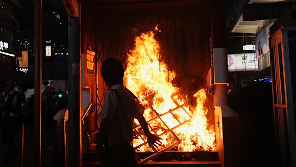 The entrance to a subway station is set on fire during a protest in Hong Kong on Sunday.