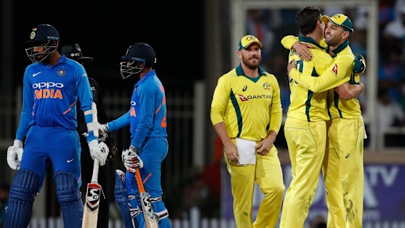 Australia celebrate their win in the third ODI in India.