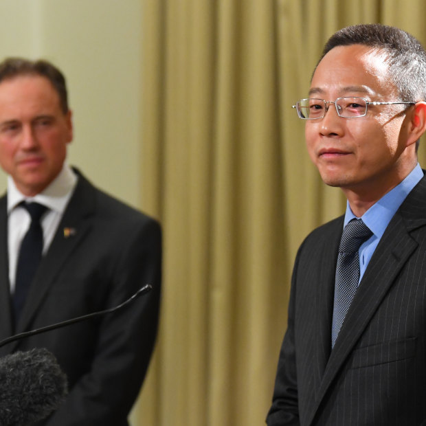 China’s consul-general for Victoria Zhou Long (right) and Health Minister Greg Hunt.