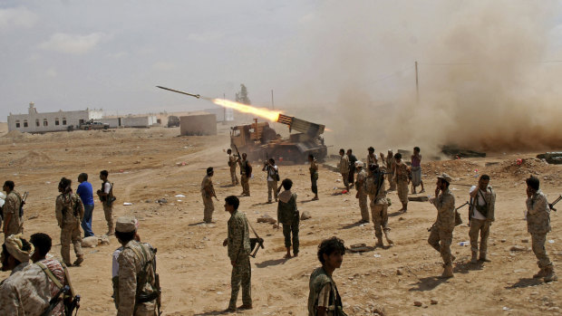 Yemeni soldiers fire rockets at mountainous positions of al-Qaeda militants at the town of Meyfaa, one of many occupied by al-Qaeda, in May 2014.