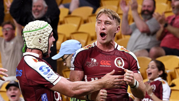 Tate McDermott celebrates a Reds try