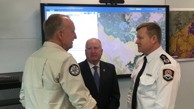 ACT Parks fire manager Neil Cooper, Emergency Services Minister Mick Gentleman, and ESA Commissioner Dominic Lane discuss the bushfire risk.