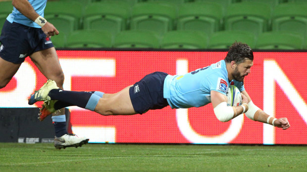 Try time: veteran centre Adam Ashley-Cooper crosses to score the opener for the Waratahs.