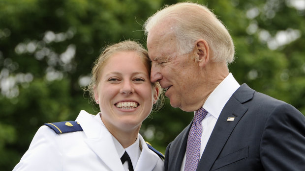 How close is too close? Newly commissioned officer Erin Talbot poses for a photograph with then Vice-President Joe Biden in 2013.