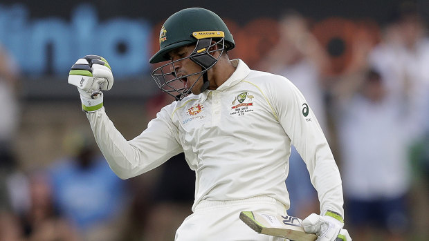 Usman Khawaja celebrates making 100 runs.