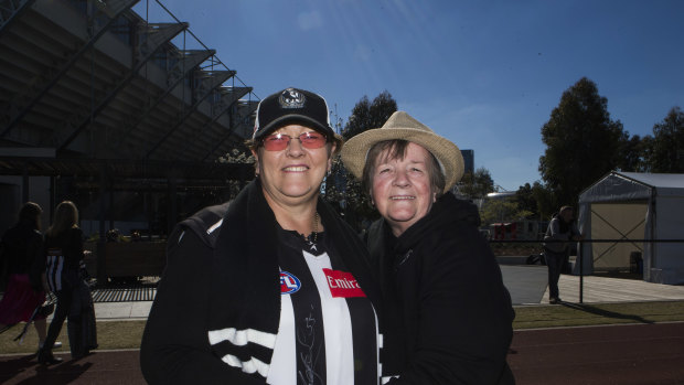Side by side: Janet Saunders, left, of Brisbane, and her mother Jessie Hatch, of Benalla, felt compelled to attend the post grand final Collingwood supporters' day.