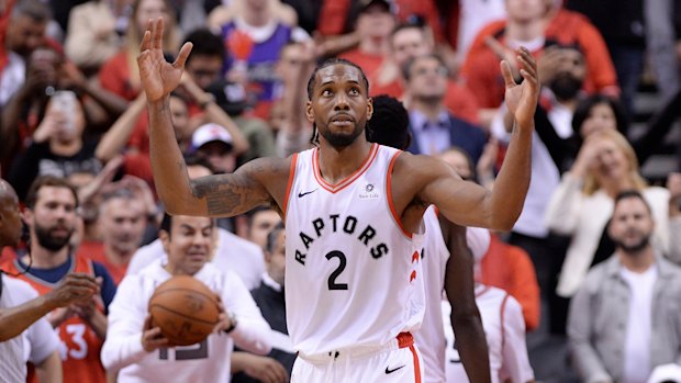 Kawhi Leonard reacts following the Raptors' win in game three against the Bucks.