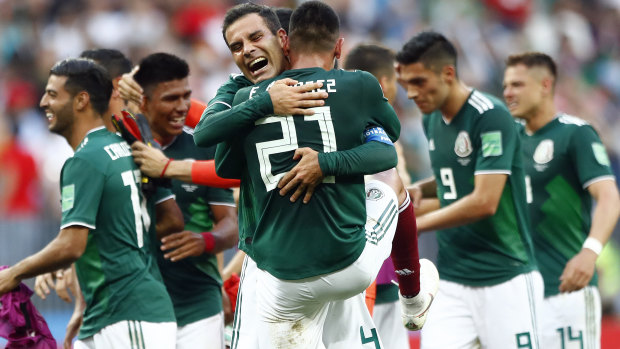 Mexico players celebrate after beating Germany.