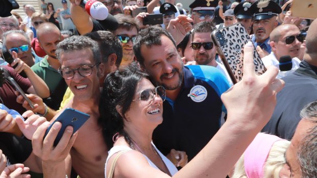 Italian Deputy Prime Minister Matteo Salvini poses for selfies with his supporters at Lido Cala Sveva in Termoli.