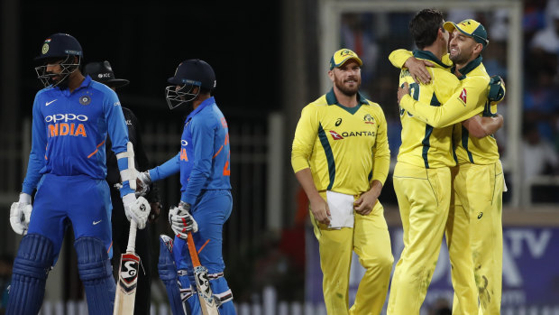 Australia celebrate their win in the third ODI in India.