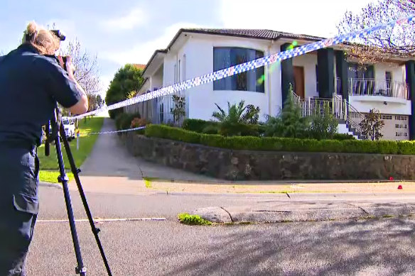 Police photograph a Craigieburn home targeted in a drive-by shooting. 