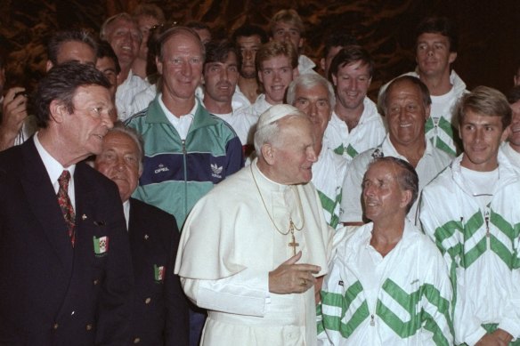 Pope John Paul II stands in front of Jack Charlton and  with the Ireland team during the World Cup in Italy.