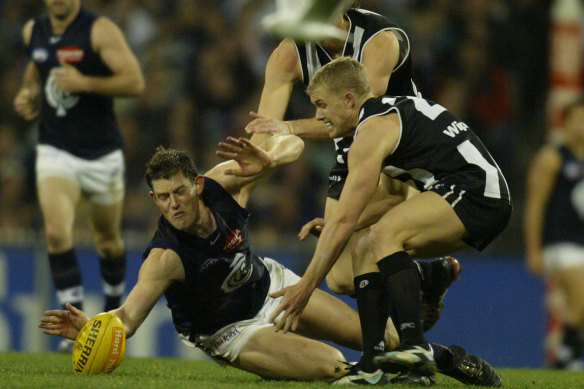 Barnaby French dives for the ball as well as Collingwood’s Takyn Lockyer.