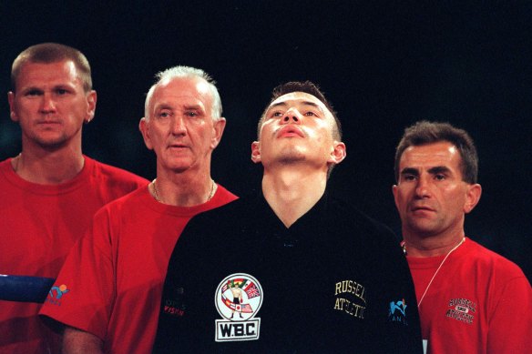 Johnny Lewis, second from left, with Kostya Tszyu before a contest.