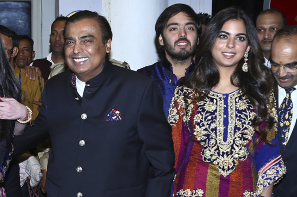 Mukesh Ambani with son Anant and daughter, Isha. The children will take on senior roles in the conglomerate.