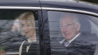 King Charles and Queen Camilla leave Clarence House in London on Tuesday.