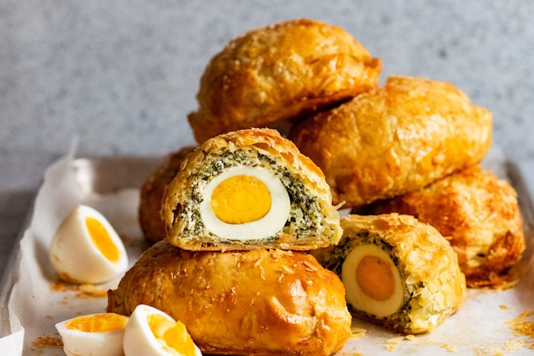 Cut open these spinach and ricotta pies to reveal an egg-cellent surprise.