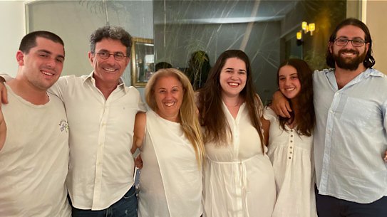 Lisa Segelov, an Australian woman living in Israel whose children have been drafted to fight in the war against Hamas. From left to right: Tomer Shevel, 22, operations soldier in tank unit, Natie Shevel, 55, Lisa Segelov, 58, Maya Shevel, 25, Lior Shevel, 19, elite combat unit, and Avi Shevel, 27, combat tank unit. 
