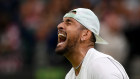 Nick Kyrgios celebrates beating Stefanos Tsitsipas during their third round match at Wimbledon.