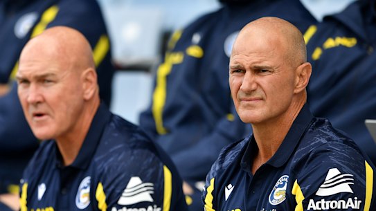 .Parramatta Eels coach Brad Arthur (right) with former St George Illawarra Dragons coach Paul McGregor watch play during a match against the Cronulla Sharks . Round 2 of the 2022 season. Ph