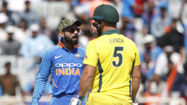 Aaron Finch and Virat Kohli get up close and personal in Ranchi in March.