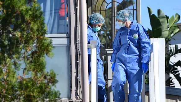 Forensic officers comb the Bent Street house on Monday.