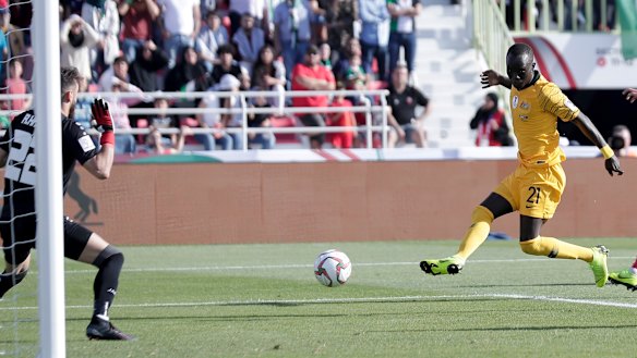 On the money: Awer Mabil scores to put the Socceroos two goals up against Palestine.