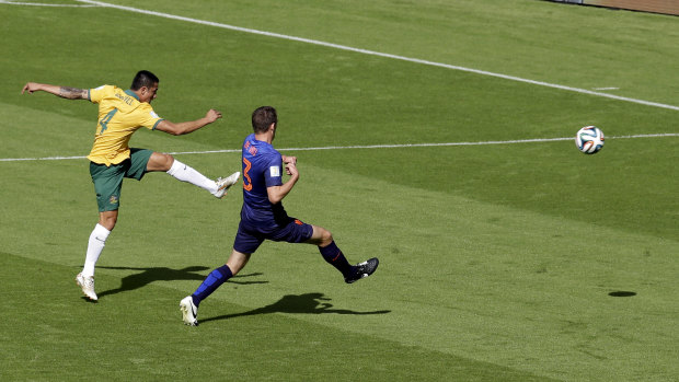 Tim Cahill scores against the Netherlands at the 2014 World Cup in Brazil.