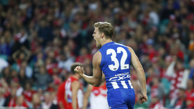 Kicking goals Mason Wood thumps through another major for the Roos against the Swans.