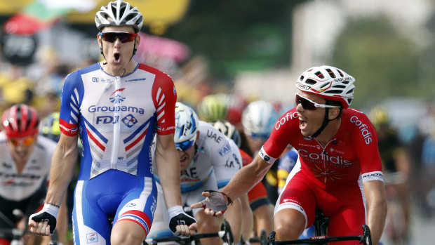 France's Arnaud Demare, left, celebrates as he crosses the finish line to win stage 18.