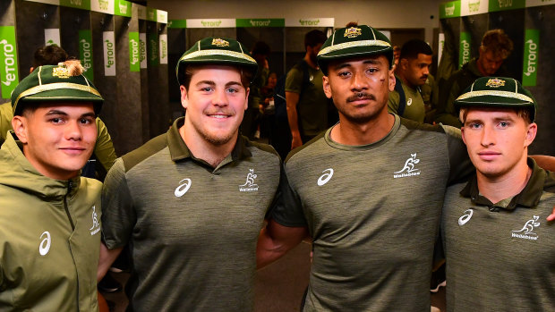 Noah Lolesio, Fraser McReight, Irae Simone and Tate McDermott crack half-smiles after receiving their first Test caps post-game.