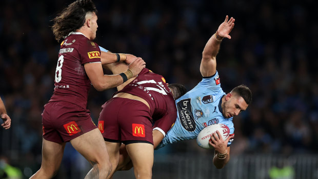 Queensland’s Jeremiah Nanai upends NSW’s Ryan Matterson.