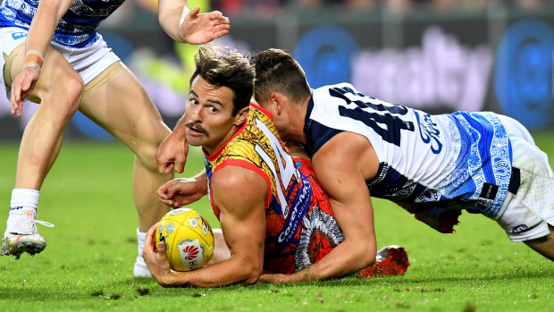 Suns' Lachie Weller fights for the ball against Cat Luke Dahlhaus. 