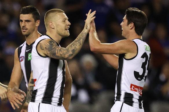 Jordan De Goey celebrates one of his six goals in the Magpies’ win over North Melbourne.