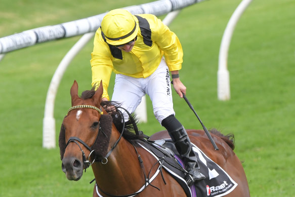 Tom Marquand stands in the irons after winning the Ranvet on Addeybb.